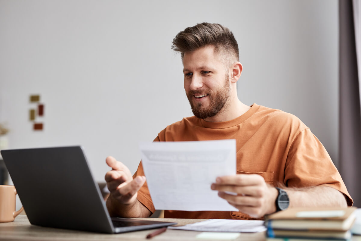 happy young tutor or student with document sitting 2026 01 08 06 54 24 utc